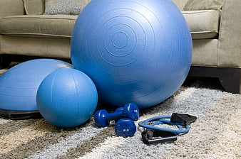 Blue Home Gym Equipment on Carpeted Floor