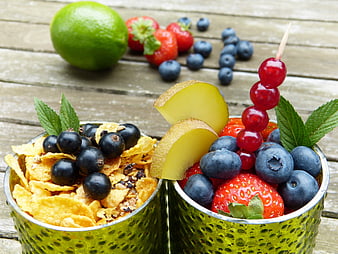 Healthy Fruit and Cereal Snacks in Green Cups