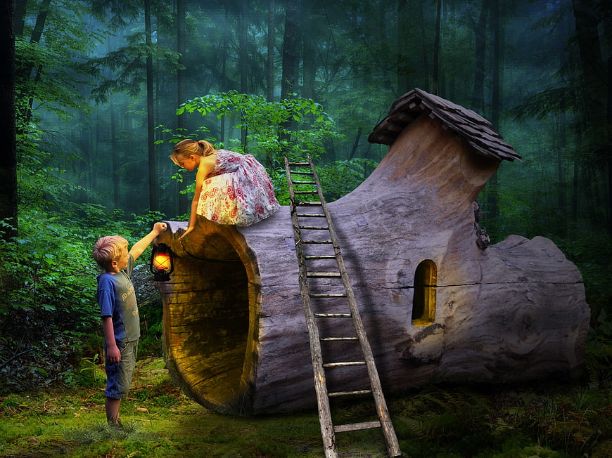 Children Exploring Whimsical Hollow Log Treehouse In Misty Forest