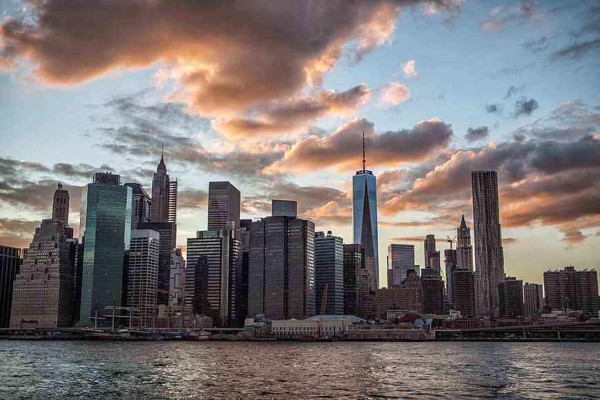 Dramatic New York City Skyline at Sunset Over the Water