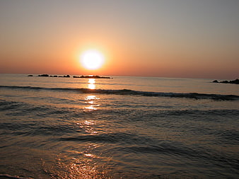 Sunrise over the Adriatic Sea with Rocky Outcrops