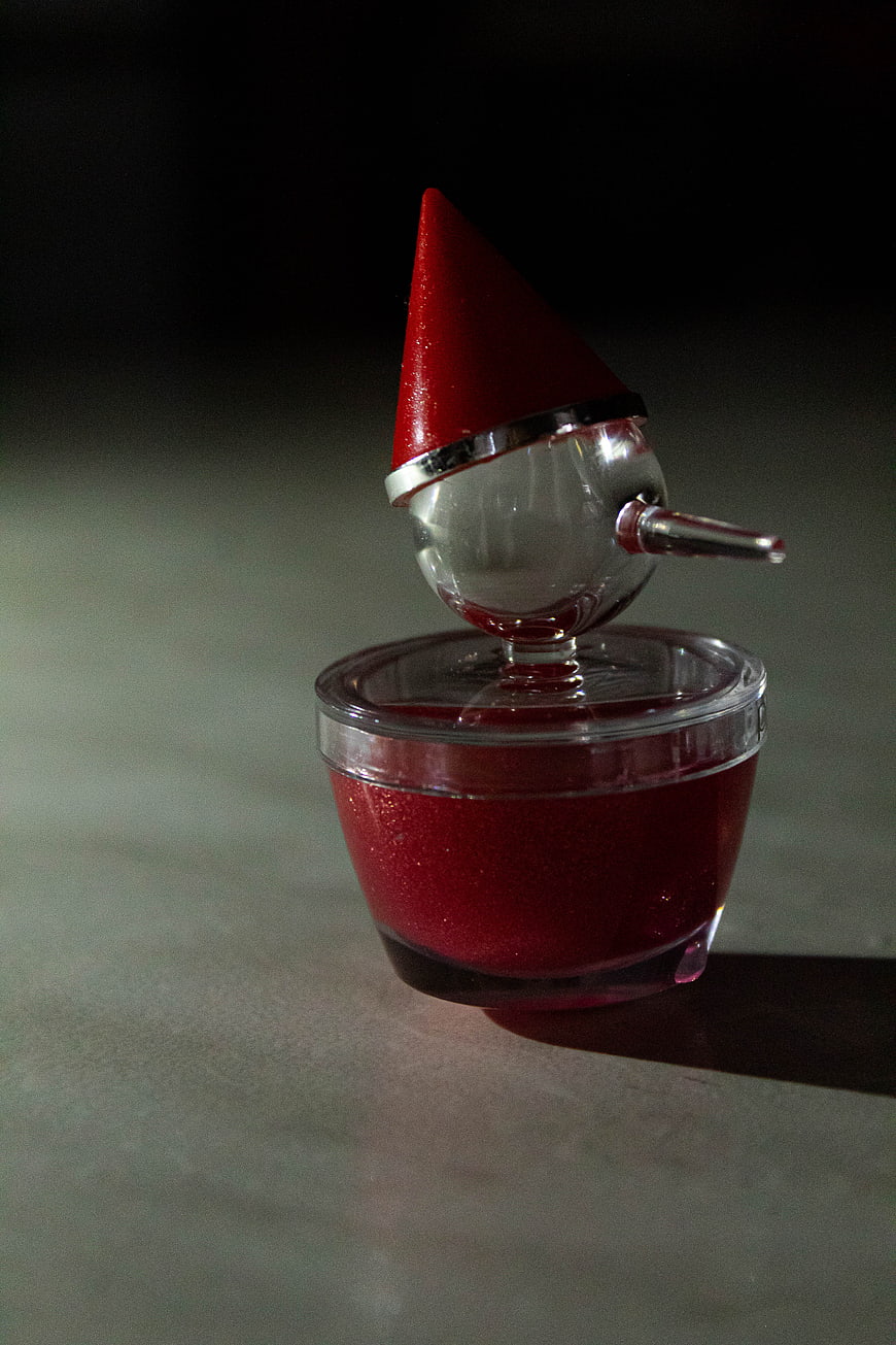 Red Glitter Christmas Gnome Ornament in Clear Plastic Cup