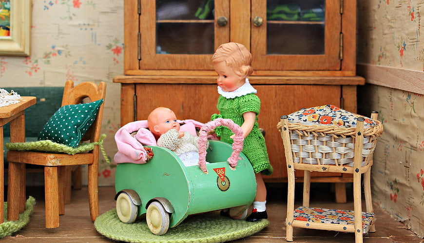 Vintage Dolls Playing with Toy Car in Miniature Room