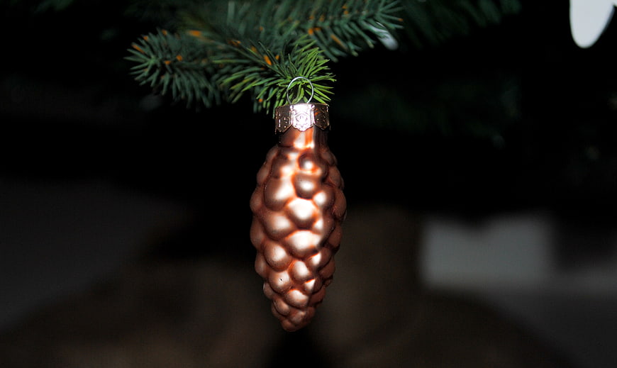 Copper Pine Cone Christmas Ornament on Pine Branch