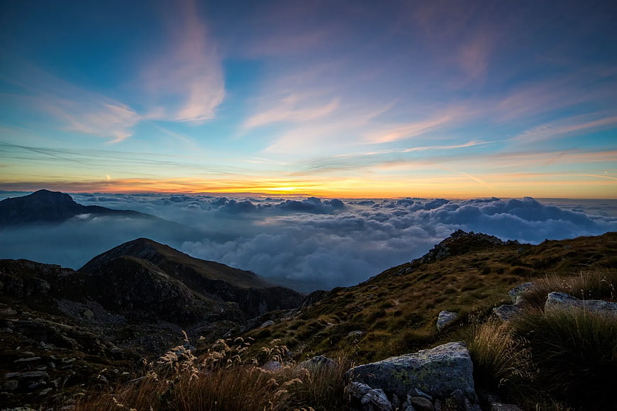 Mountain Sunrise Above Sea of Clouds