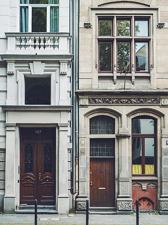Contrasting European Apartment Facades with Wooden Doors