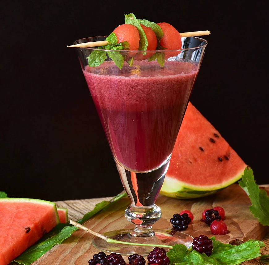 Refreshing Watermelon Smoothie Cocktail Garnished With Mint And Berries