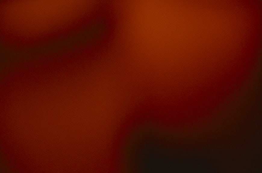 Abstract Dark Red Gradient Background with Soft Glow