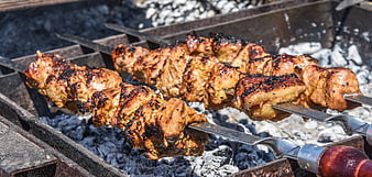 Grilled Meat Skewers On Charcoal Grill Close Up