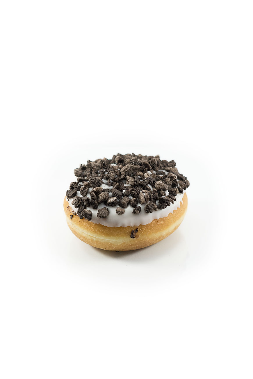 Chocolate Crumb Donut with White Icing on White Background