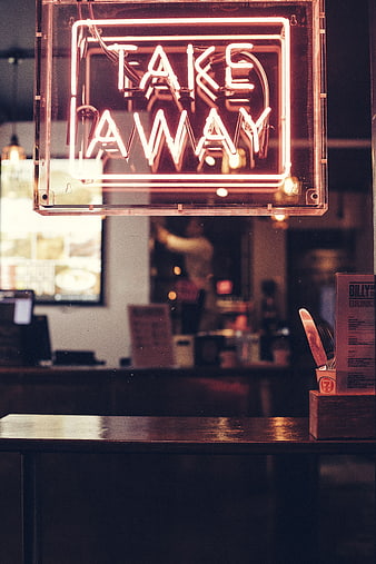 Glowing Take Away Neon Sign in Restaurant Window