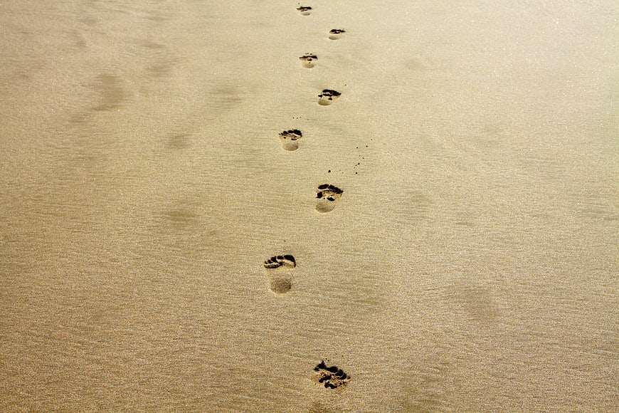 Footprints in Sand on Beach