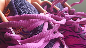 Close-up of pink Asics running shoe laces and mesh