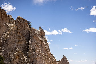 Rugged Rocky Mountain Peak Against Blue Sky