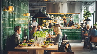 Couple Dining in Modern Green Tiled Restaurant Interior