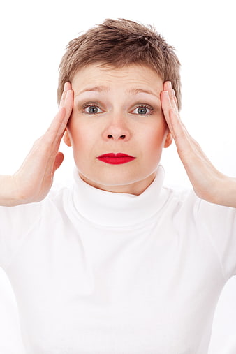 Stressed Woman Holding Head in Pain Isolated on White