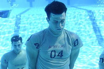 Underwater Water Polo Player Training In Swimming Pool