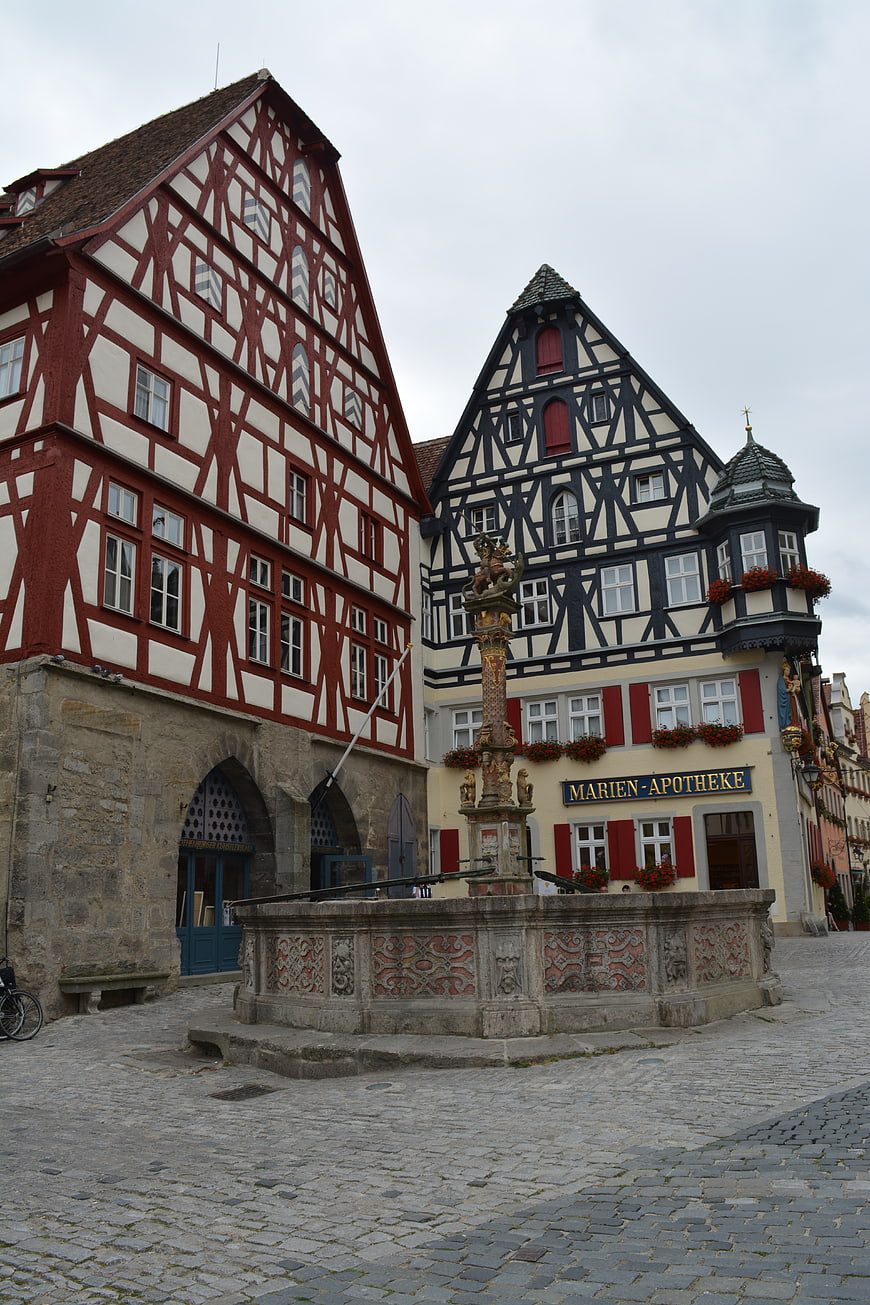 Historic Half-Timbered Buildings and Fountain in German Town Square