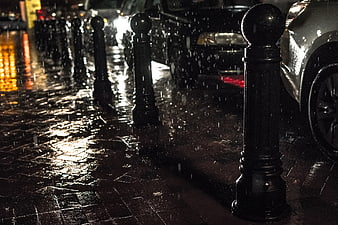Rainy Night City Street with Wet Pavement and Reflections