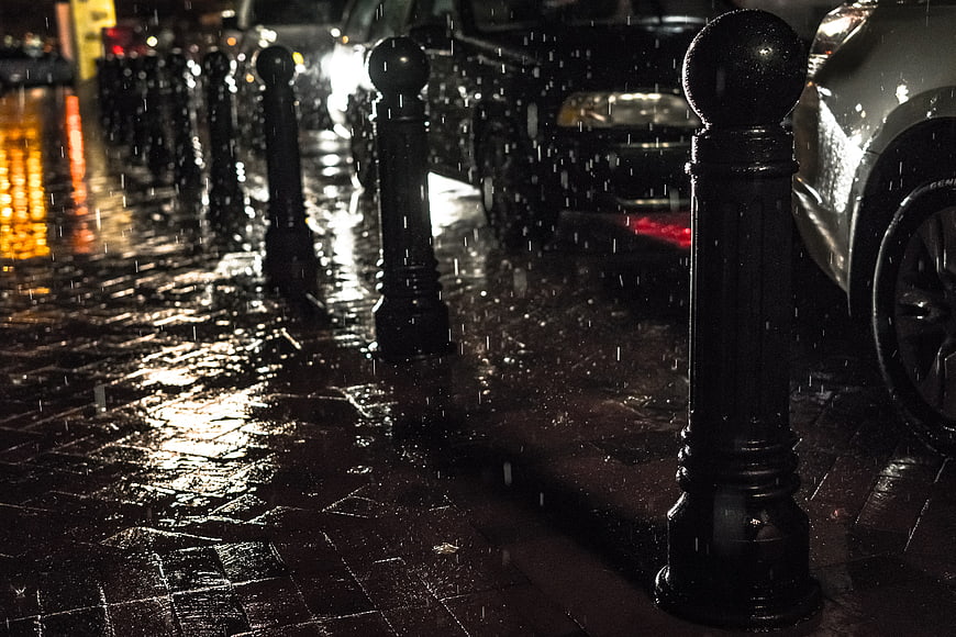 Rainy Night City Street with Wet Pavement and Reflections