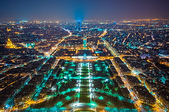 Aerial Night View of Paris Cityscape with Illuminated Gardens