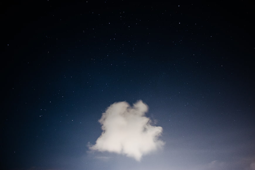 Lone Cloud in Starry Night Sky
