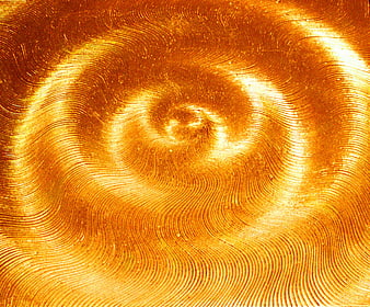 Abstract golden spiral pattern with swirling light and wave textures