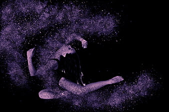 Woman in Dynamic Pose Surrounded by Purple Powder Explosion