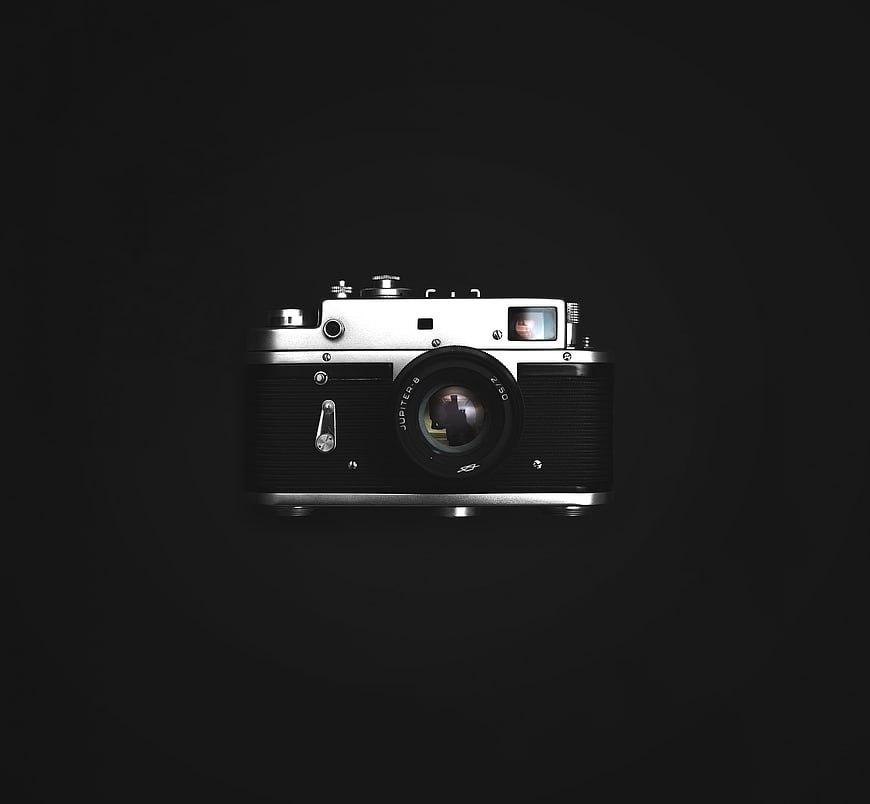 Vintage Silver and Black Film Camera on Black Background