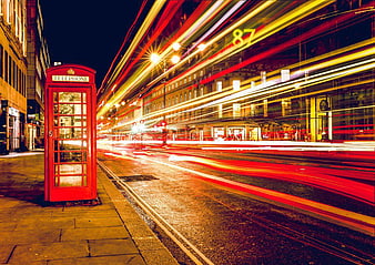 London Red Telephone Booth with Long Exposure Bus Trails