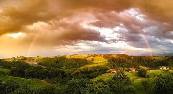 Double Rainbow Over Green Rolling Hills and Rural Farmhouses