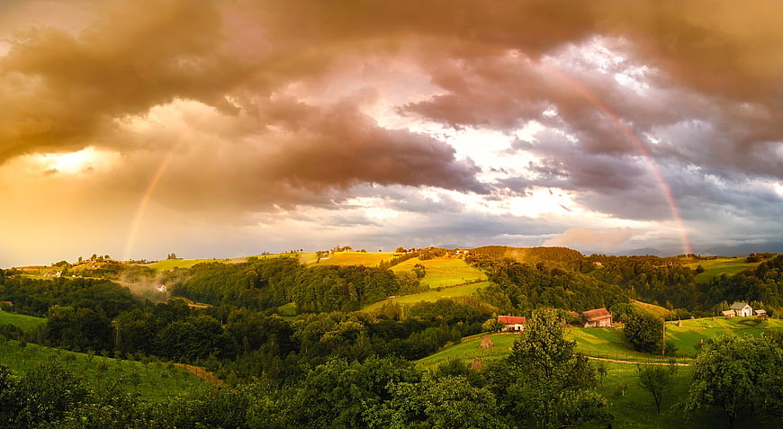 Double Rainbow Over Green Rolling Hills and Rural Farmhouses