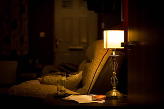 Cozy Evening Interior With Glowing Table Lamp And Armchair
