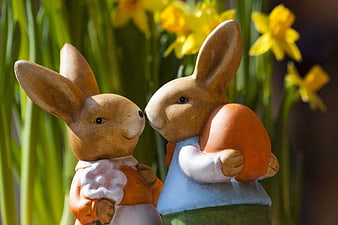 Easter Bunny Figurines with Egg and Daffodils