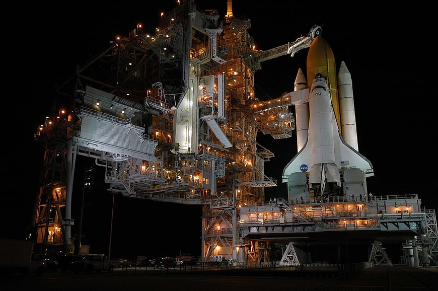 Space Shuttle Discovery on Launch Pad at Night
