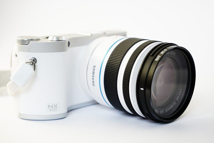 White Samsung NX300 Camera with Lens on White Background