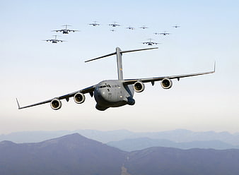 US Air Force C-17 Globemaster III Flying Over Mountains