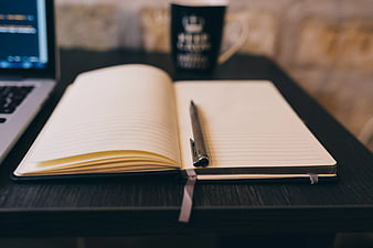Open Notebook with Pen on Desk for Writing