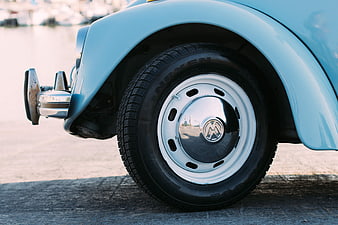 Close-up of vintage light blue Volkswagen Beetle wheel