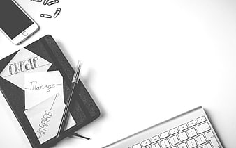 Minimalist Black and White Workspace with Notebook and Keyboard