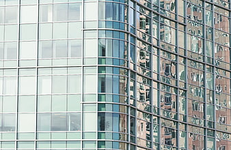 Modern Glass Office Building Facade with Reflections