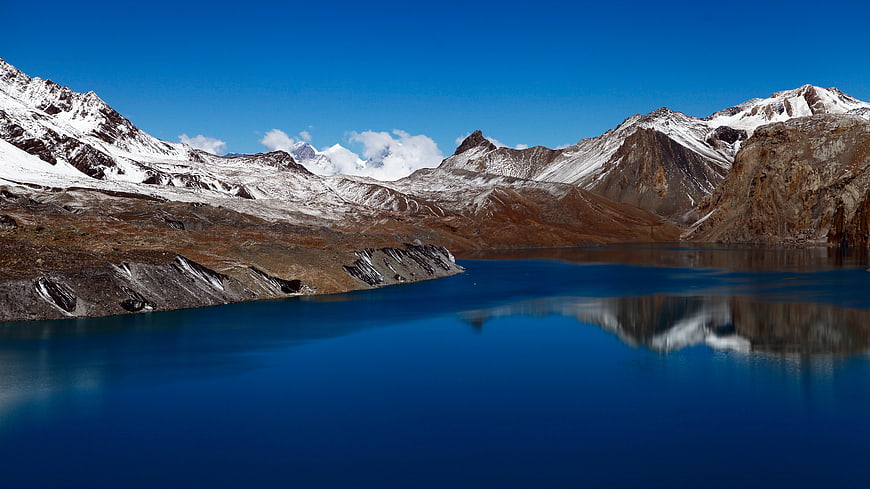 Serene Alpine Lake with Snow-Capped Mountain Reflections