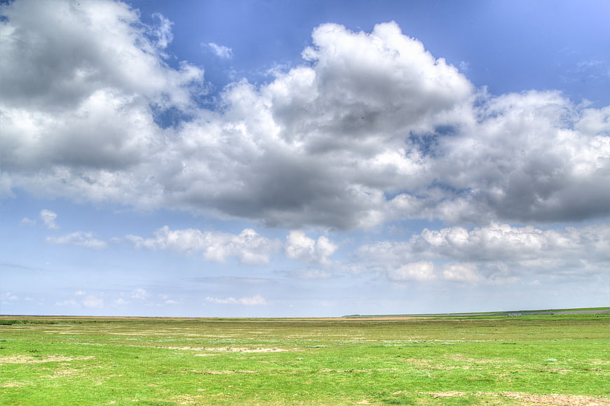 Vast Green Dutch Landscape with Dramatic Cloudy Sky