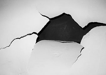 Black and white torn paper texture with dark background
