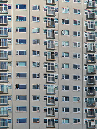 Modern Apartment Building Facade with Windows and Balconies