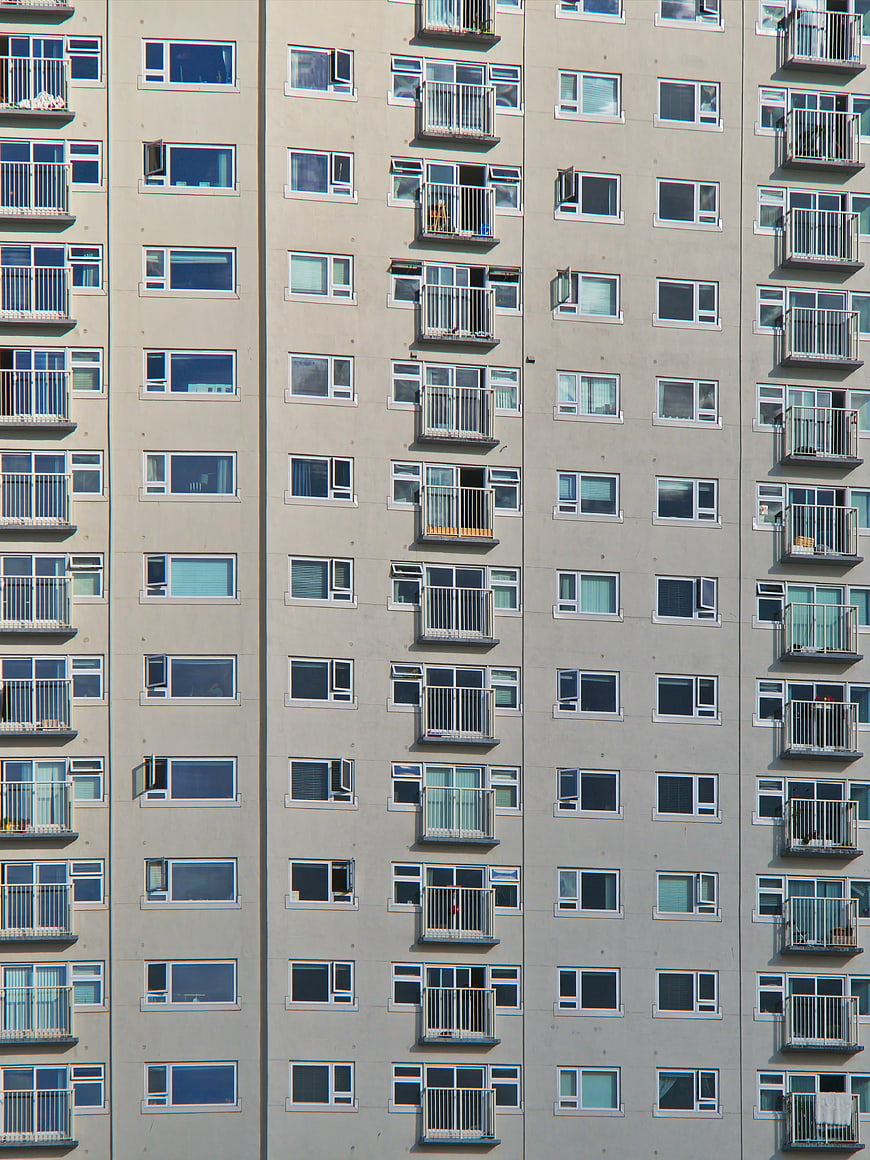 Modern Apartment Building Facade with Windows and Balconies