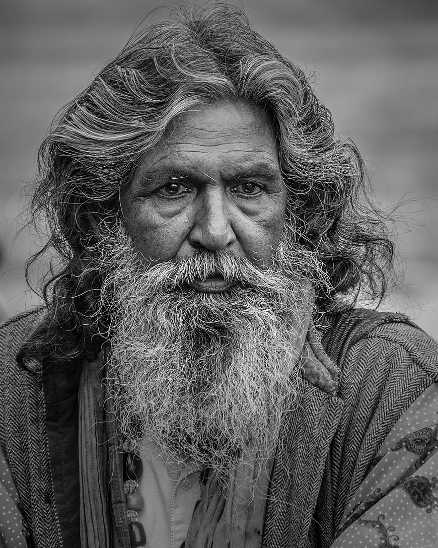 Black and white portrait of elderly man with long beard