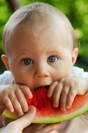 Cute Baby Eating Watermelon Slice Outdoors