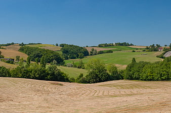 Rolling Hills and Harvested Fields in Italian Countryside