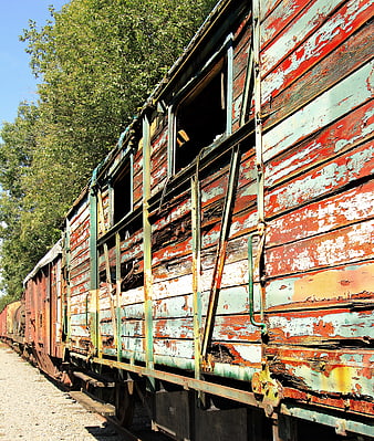 Weathered Wooden Train Car In Abandoned Rail Yard
